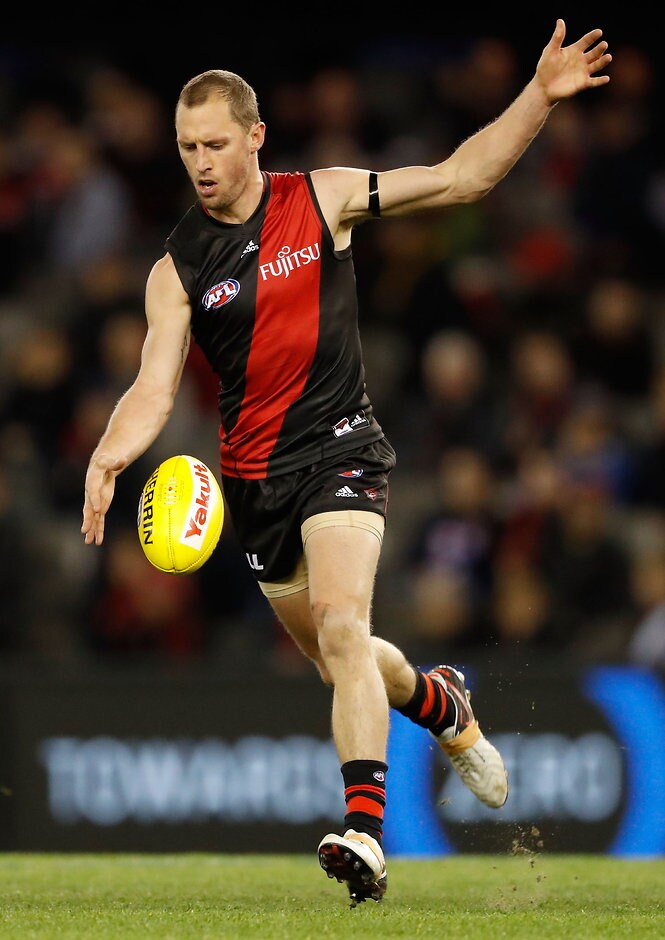 AFL 2016 Rd 22 - Essendon v Western Bulldogs MELBOURNE, AUSTRALIA - AUGUST 21: James Kelly of the Bombers kicks the ball during the 2016 AFL Round 22 match between the Essendon Bombers and the Western Bulldogs at Etihad Stadium on August 21, 2016 in Melbourne, Australia. (Photo by Adam Trafford/AFL Media)